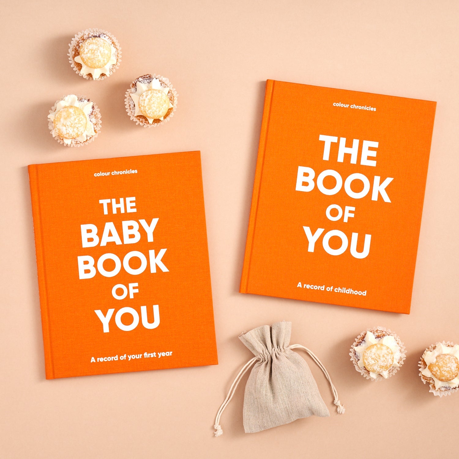 Baby and childhood memory books shown in orange