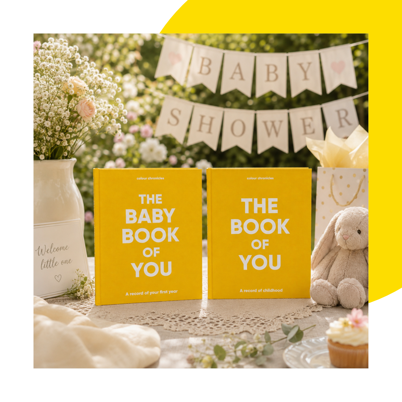 The Baby Book of You and Book of You set shown in yellow at a summer baby shower