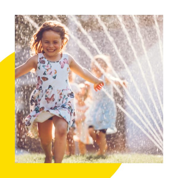 Child running through water