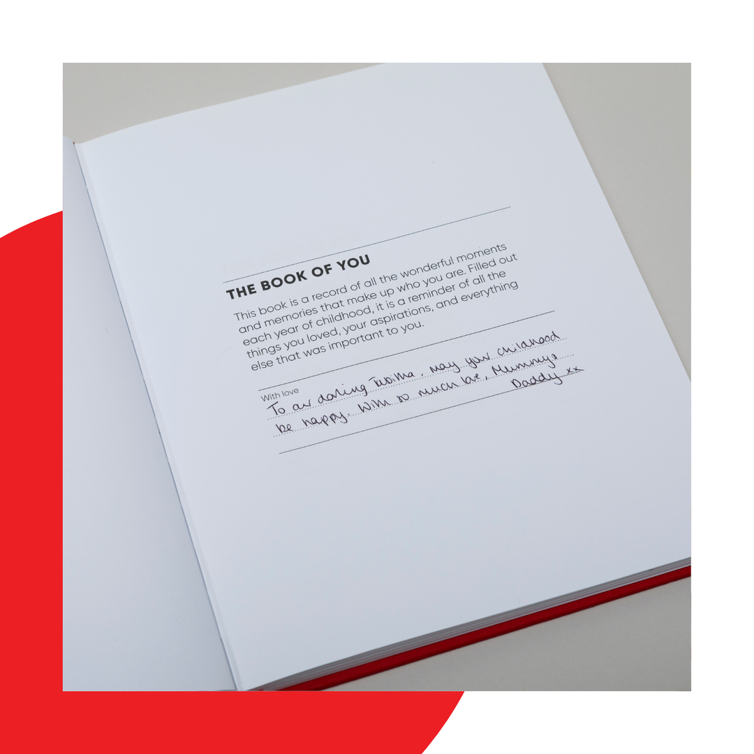 The Book of You open on the dedication page where you write a message to the baby