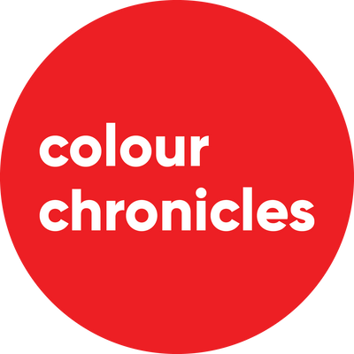 Colour Chronicles logo white writing on red circle